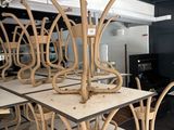 many chairs and tables in a room with black walls