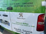 a green and white van parked on the side of the road
