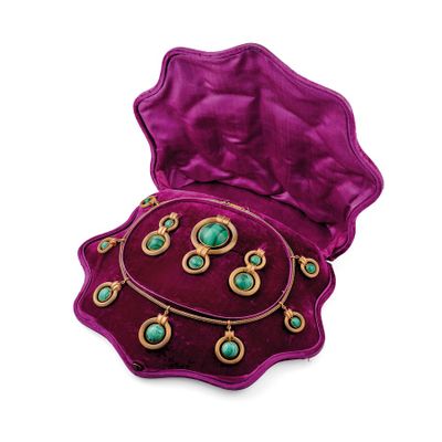an image of a purple velvet box with a necklace and earrings in it
