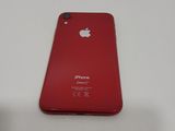 an image of a red iphone sitting on top of a white table