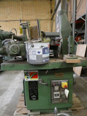 a machine that is sitting on a pallet in a warehouse