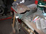 a workbench with tools on it in a garage