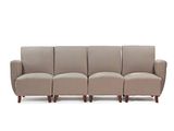 a close up of a couch with four chairs on it
