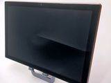 a flat screen tv sitting on top of a stand