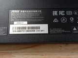 the back side of a laptop with a sticker on it
