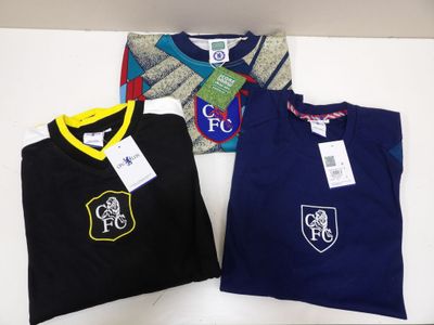 three t - shirts with a crest on the front and a crest on the back