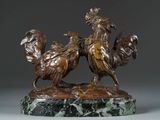 bronze statue of two roosters on a marble base on a gray background