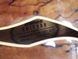 an image of a close up of a guitar with a label on it