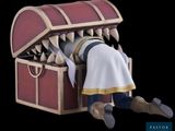 a small wooden chest with a shark ' s mouth sticking out of it