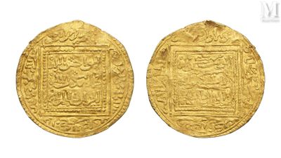 two gold coins, one of which has a picture of a man and a woman on it