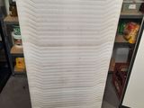 a picture of a stack of mattresses in a store