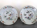 two plates that are sitting on a table