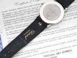 a watch sitting on top of a piece of paper