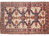 tapis persan ancien à motifs bleus et rouges