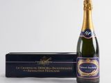 a bottle of champagne and a box of chocolate