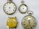 three different types of pocket watches are displayed on a white surface