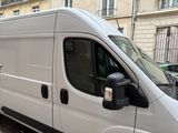 a white van that is parked on the side of the street