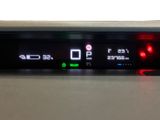 a close up of a car ' s dashboard with a clock on it