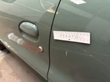 a sticker on the door of a car that says caution