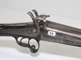 a close up of a gun that is on display on a table