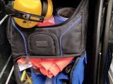a black bag with a yellow hard hat and a yellow hard hat in it