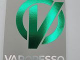 a close up of a metal sign with a green logo on it