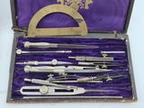 many different tools in a purple case on a table