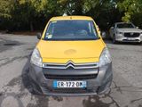a yellow van that is parked in a parking lot