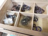 a wooden box filled with lots of different types of buttons