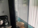 a refrigerator and a coffee maker in a kitchen