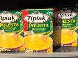 three boxes of tulipak are on a shelf in a store