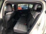 the back seats of a car are empty in the back of the car