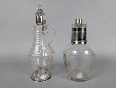 two glass salt and pepper shakers sitting next to each other