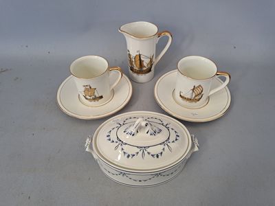 four cups and saucers sitting on a table