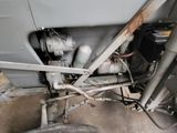 a close up view of a vehicle ' s engine and exhaust pipes