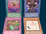 three cards of different colors and designs on a blue background