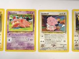 four pokemon cards are lined up on top of each other