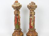 pair of antique hand painted candlesticks with figures on them
