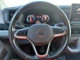 the interior of a car with a steering wheel and dashboard controls