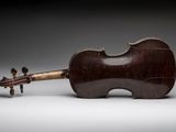 an antique violin with a wooden case and a wooden bow