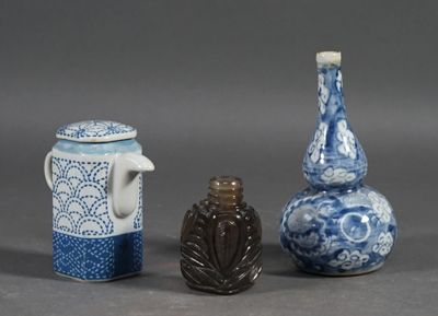 three small vases sitting next to each other on a table