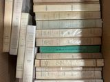 a lot of books in a box on the floor