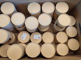 a cardboard box full of empty cups and lids
