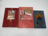 three books that are sitting on a table