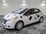 a picture of a white car with black spots on it