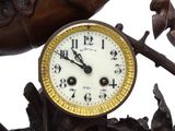 a clock that is sitting on top of a statue