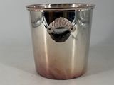 a silver cup that is sitting on a table
