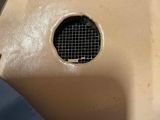 a small hole in the back of a blue shirt
