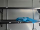 a shelf with a blue bag on it in a kitchen
