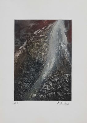 an aerial view of a river running through a valley in the mountains